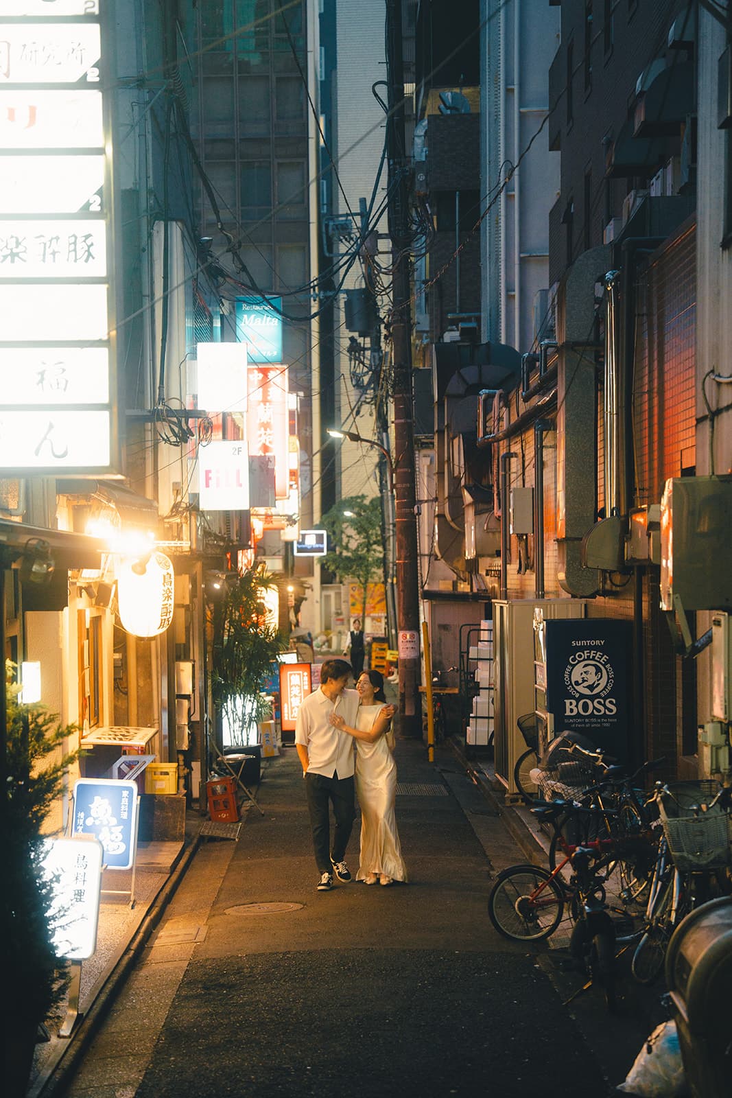 Dancing in a neon-lit Tokyo alley