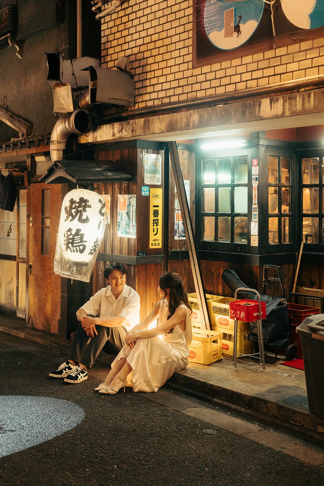Sitting beneath a yakitori lantern in a Tokyo alley